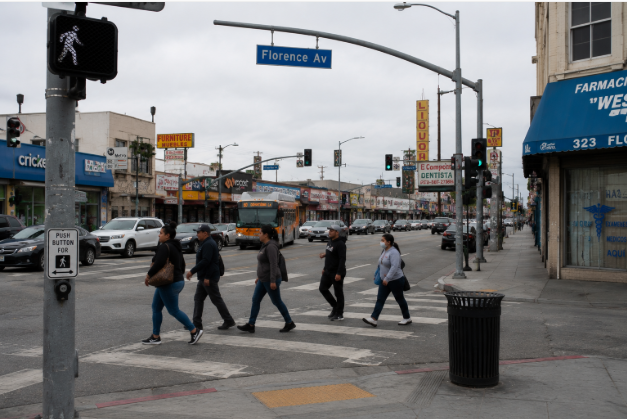 Street-level view of a pedestrian crossing in Huntington Park near Florence Avenue